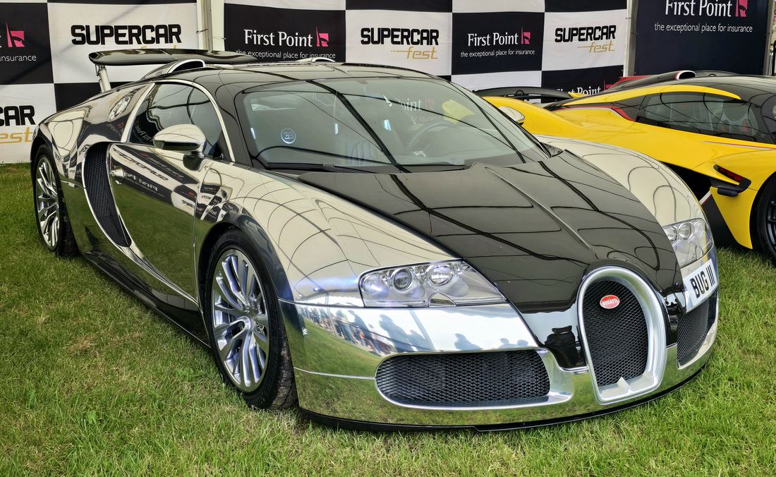 A chrome and black Bugatti Veyron 16.4 at a car show
