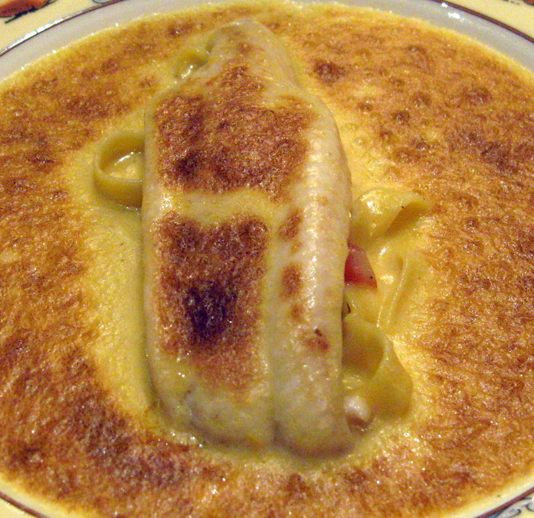 A fillet of sole with noodles in a golden glazed sauce, served at Paul Bocuse's restaurant